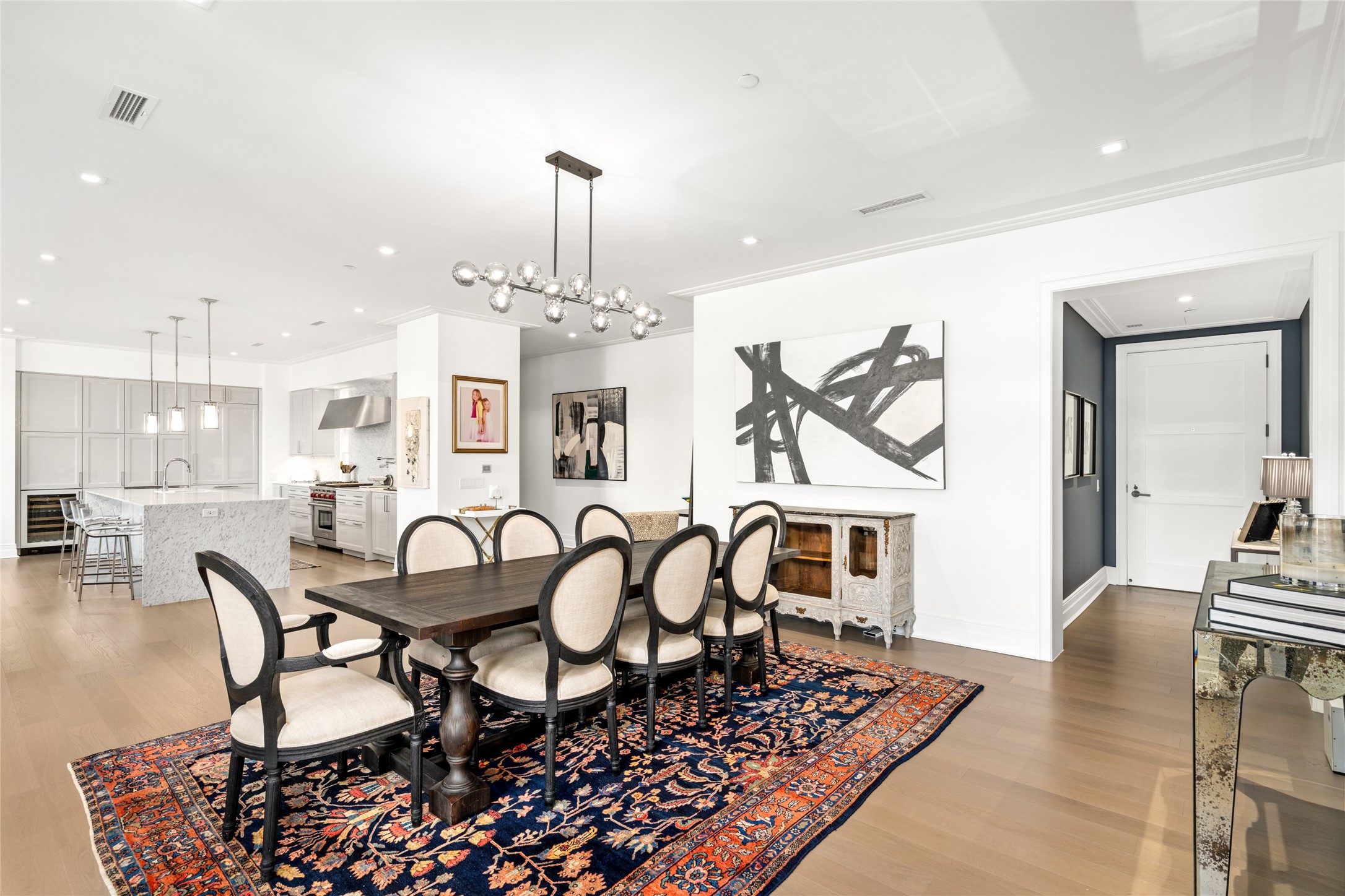 6017 Memorial Drive, Unit 202 Houston, TX 77007 - Photo 9 of 36 Entering through the front door foyer offers a glimpse of the unit's opulence. A sophisticated smokey glass wrought iron chandelier and a substantial amount of natural light help to reveal all the intricacies of this detailed unit.