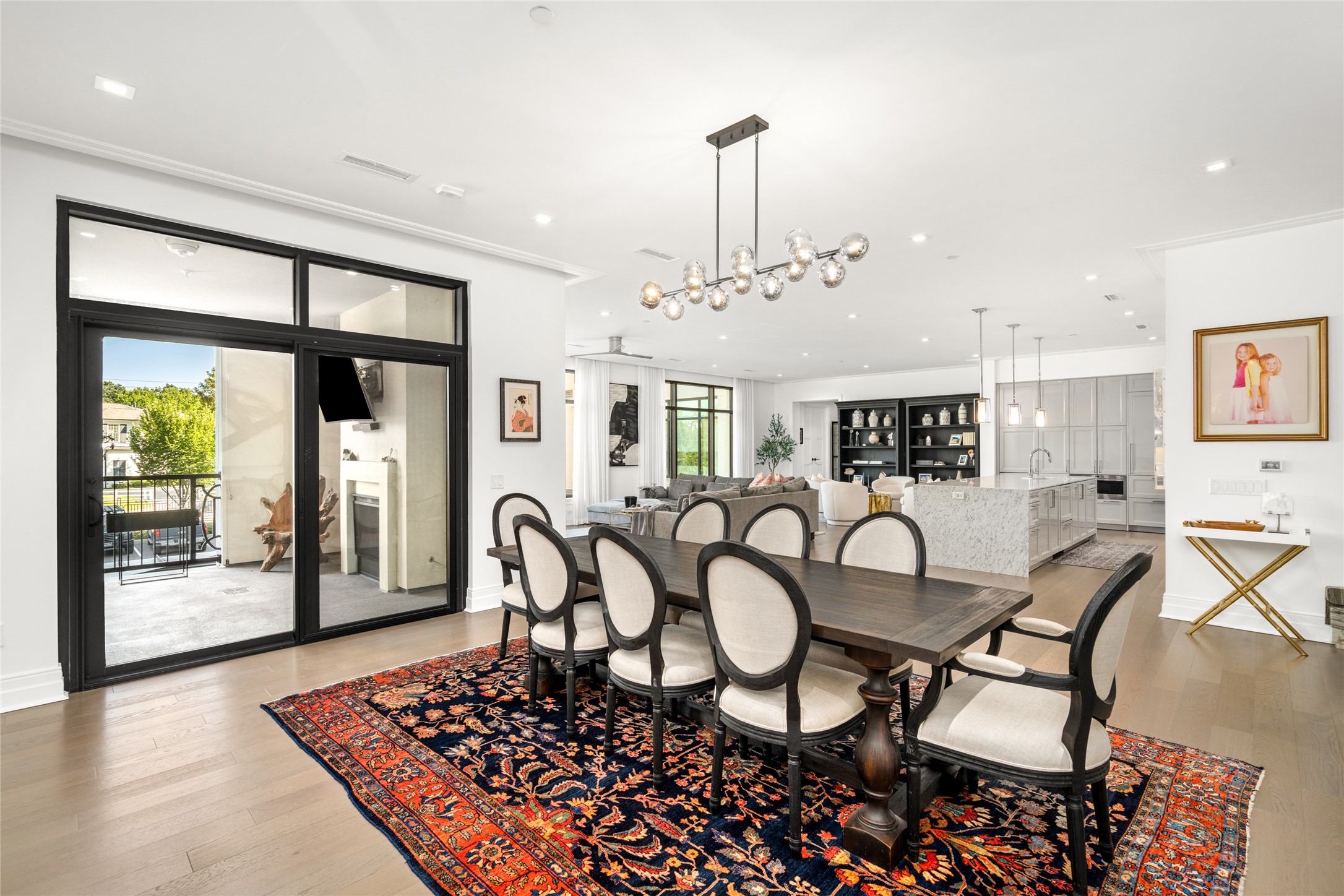 6017 Memorial Drive, Unit 202 Houston, TX 77007 - Photo 10 of 36 The dining room is thoughtfully positioned between the living room, kitchen, and large terrace highlighting a welcoming layout for any occasion.