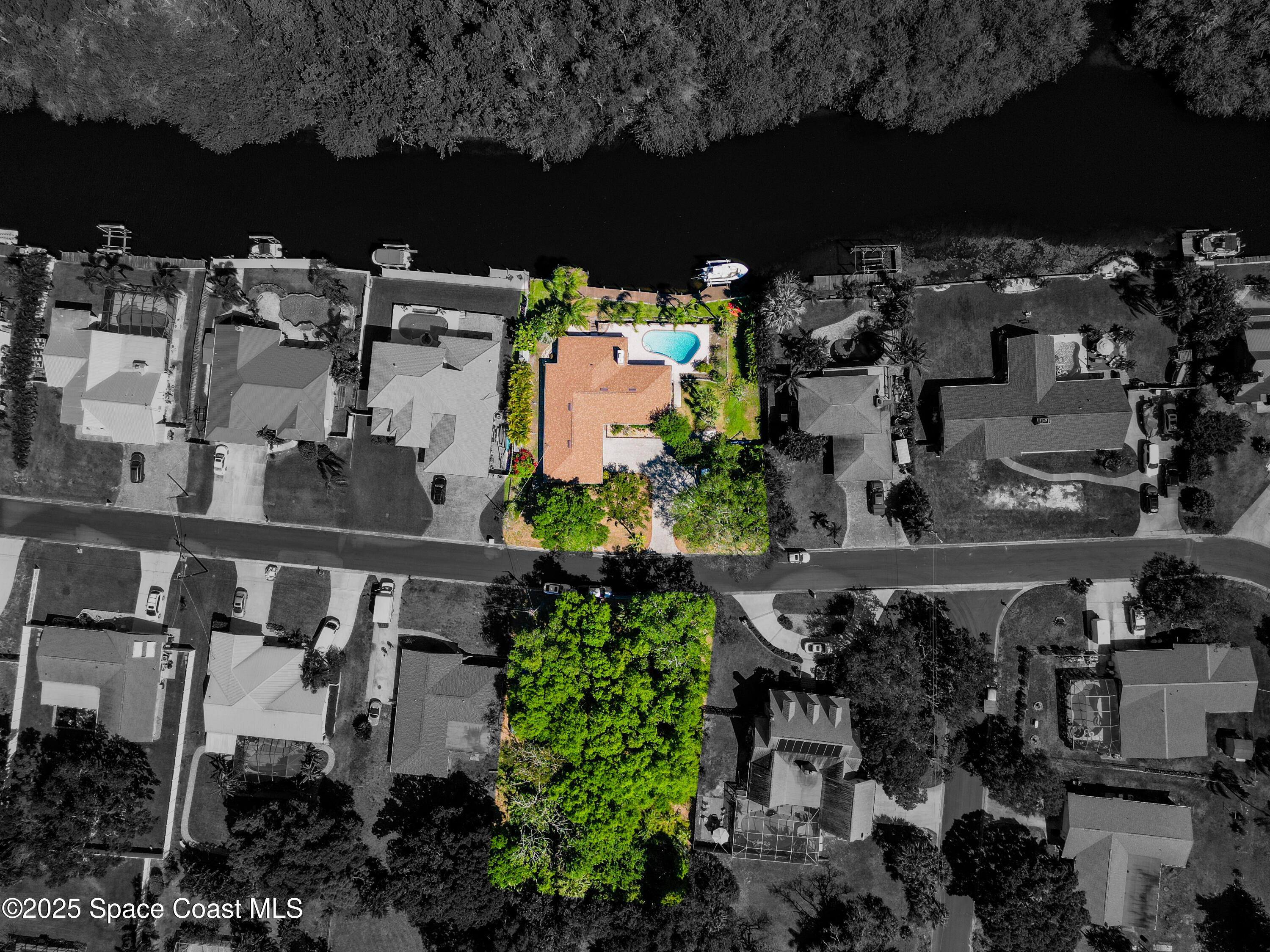 1020 Sunswept Road Northeast Palm Bay, FL 32905 - Photo 1 of 1 Lot is wooded on paved road