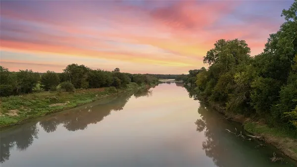 a view of lake with green space