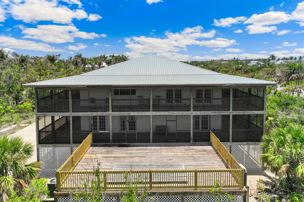 4190 Loomis Avenue Boca Grande, FL 33921 - Photo 17 of 24 a view of house with large windows