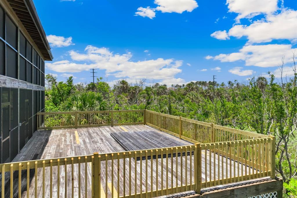 4190 Loomis Avenue Boca Grande, FL 33921 - Photo 19 of 24 a view of a balcony with wooden floor