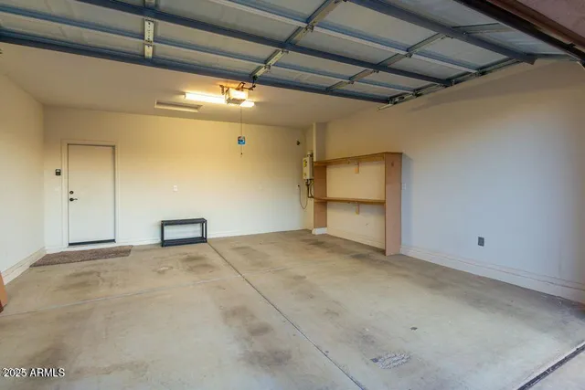 a view of a house with backyard and a tree