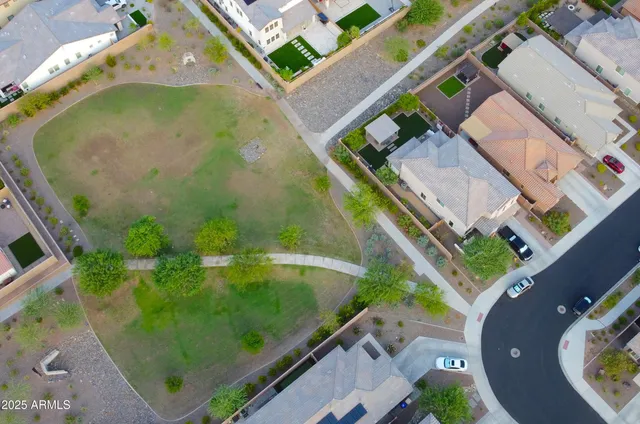 an aerial view of a house with a ocean view