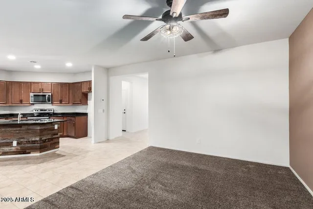 a view of a kitchen with a sink and a stove top oven