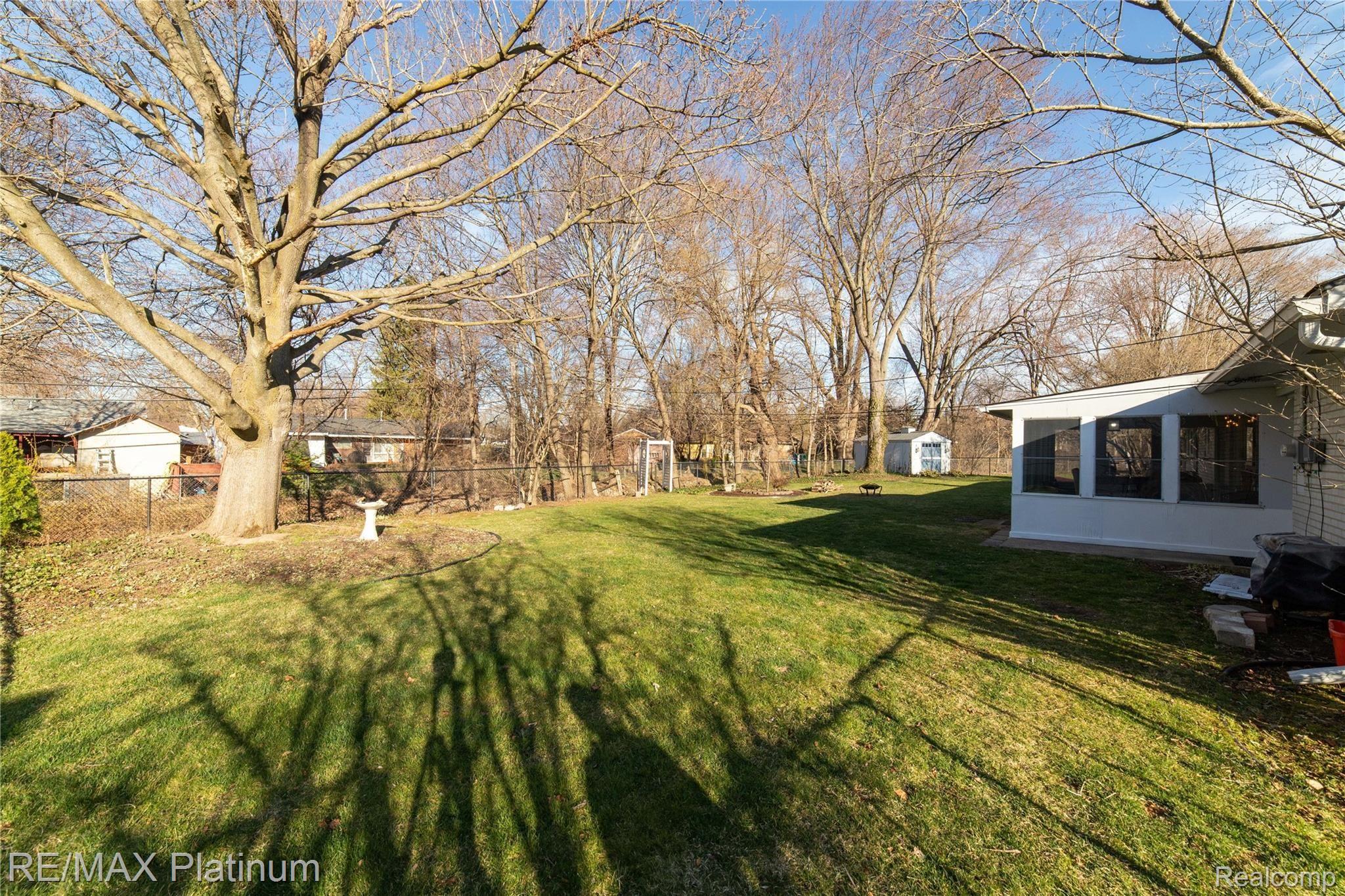 23857 Ripple Creek Novi, MI 48375 - Photo 21 of 28 yard backs up to treeline with fence