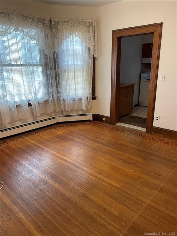 250 Willow Street, Unit 2 New Haven, CT 06511 - Photo 20 of 25 an empty room with wooden floor and windows