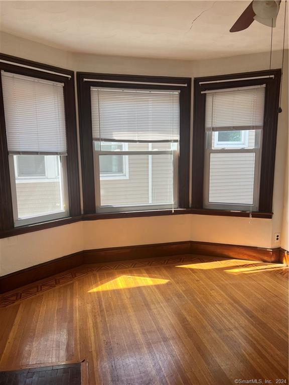 250 Willow Street, Unit 2 New Haven, CT 06511 - Photo 6 of 25 a view of a room with wooden floor and a window