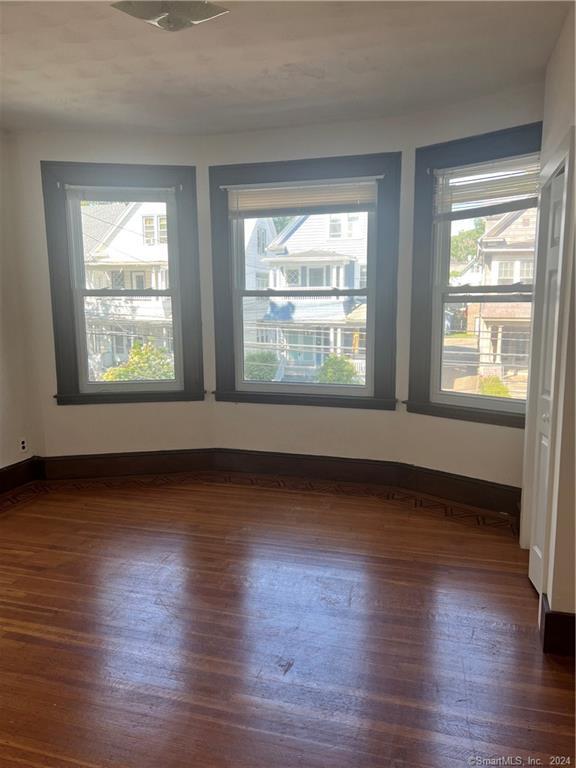 250 Willow Street, Unit 2 New Haven, CT 06511 - Photo 7 of 25 a view of an empty room with wooden floor and a window
