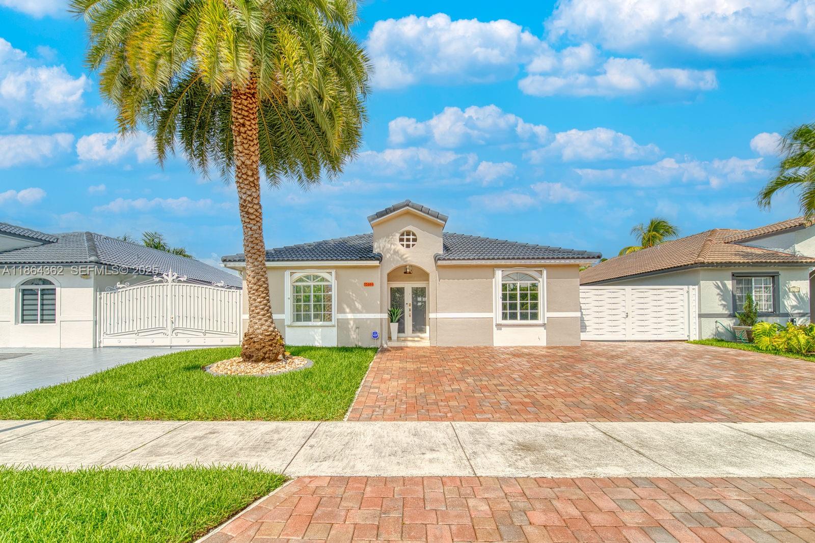 a front view of a house with garden