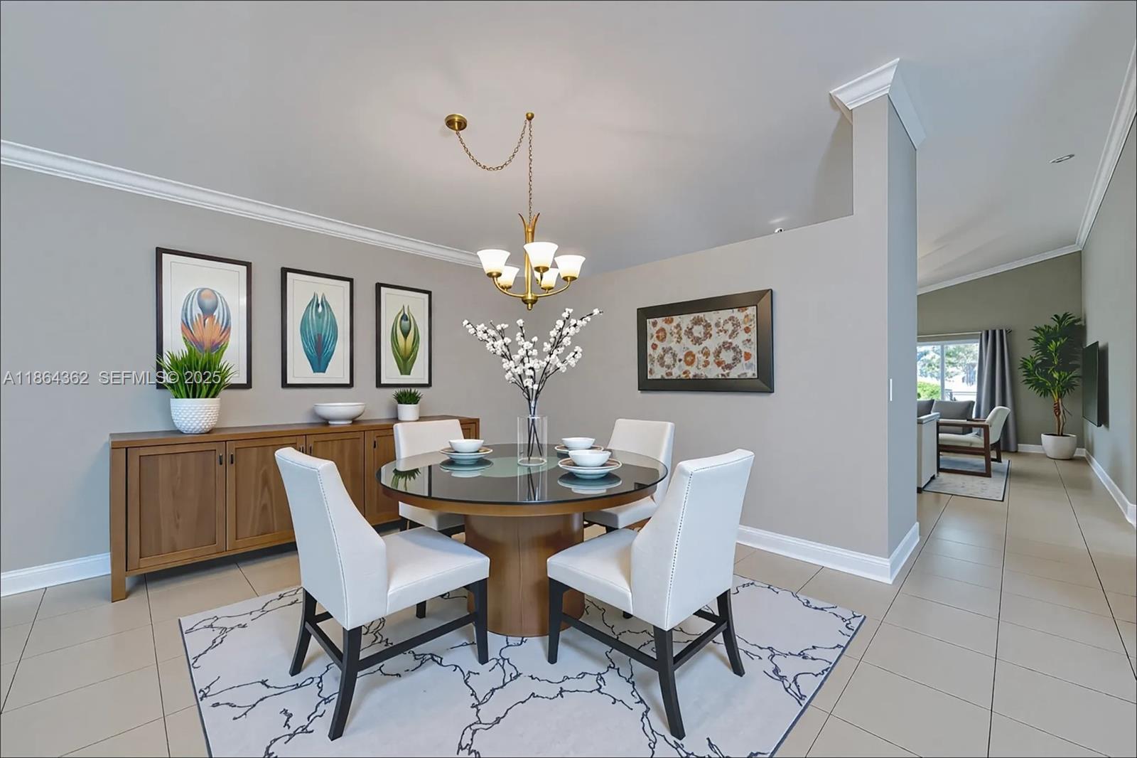 16886 Southwest 143rd Place Miami, FL 33177 - Photo 12 of 39 a dining room with furniture a livingroom and chandelier
