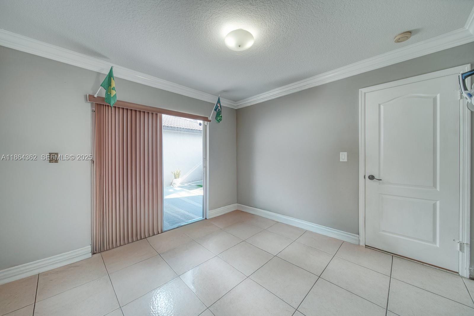 16886 Southwest 143rd Place Miami, FL 33177 - Photo 25 of 39 a view of an empty room and window