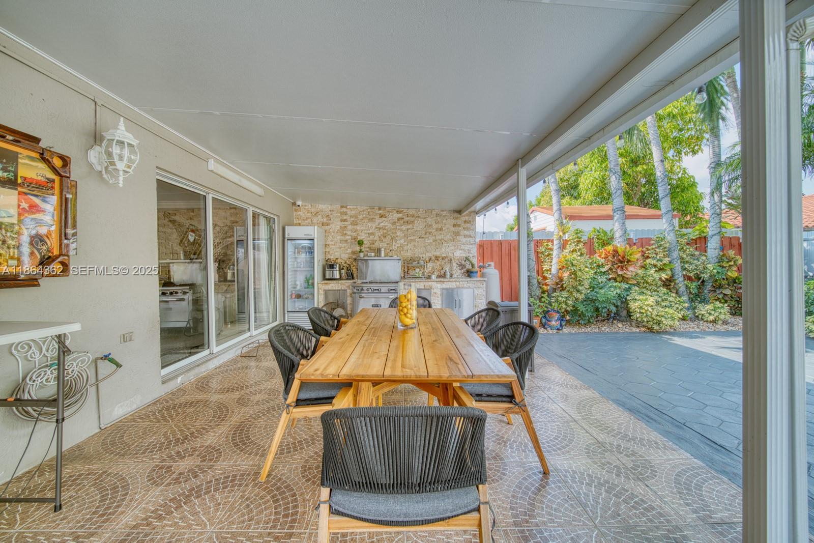 16886 Southwest 143rd Place Miami, FL 33177 - Photo 31 of 39 a room with pool tables and large windows