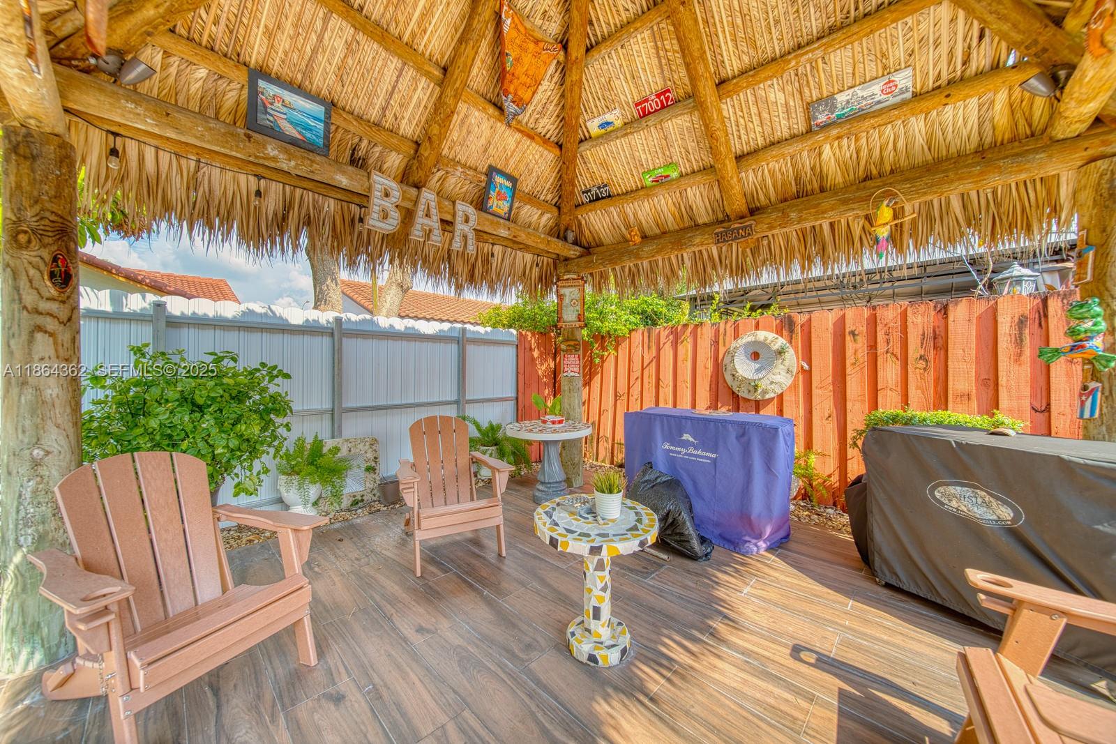 16886 Southwest 143rd Place Miami, FL 33177 - Photo 35 of 39 a backyard of a house with seating space