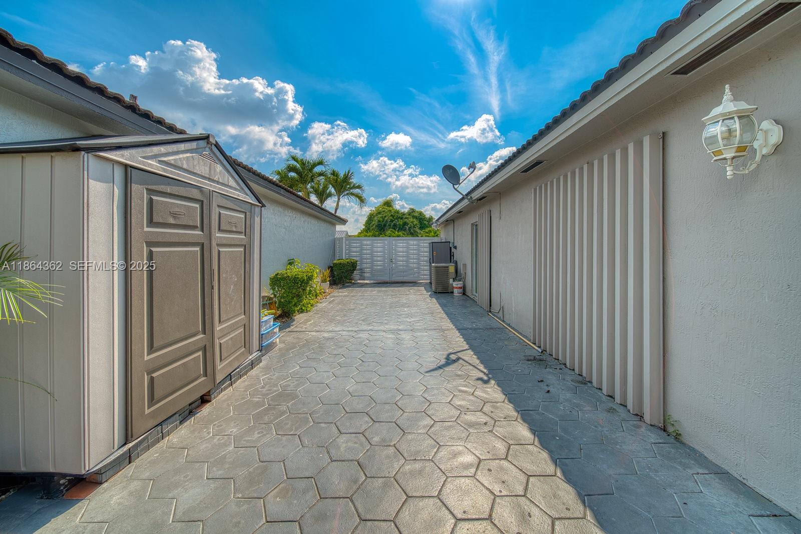 16886 Southwest 143rd Place Miami, FL 33177 - Photo 38 of 39 a view of a house with a garage