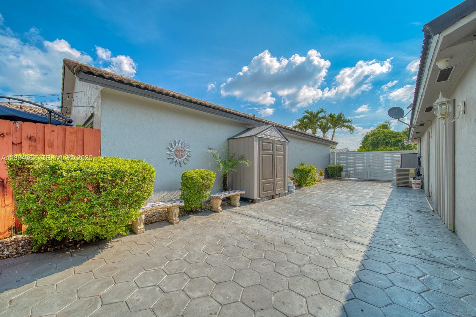 16886 Southwest 143rd Place Miami, FL 33177 - Photo 39 of 39 a view of a house with backyard and a garden