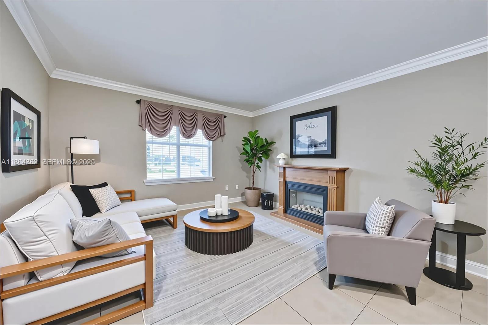 16886 Southwest 143rd Place Miami, FL 33177 - Photo 5 of 39 a living room with furniture and a fireplace
