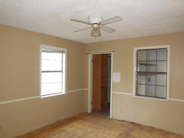 1104 Foreman Road Doyline, LA 71023 - Photo 10 of 11 an empty room with windows and fan