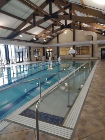 a view of a swimming pool with a yard