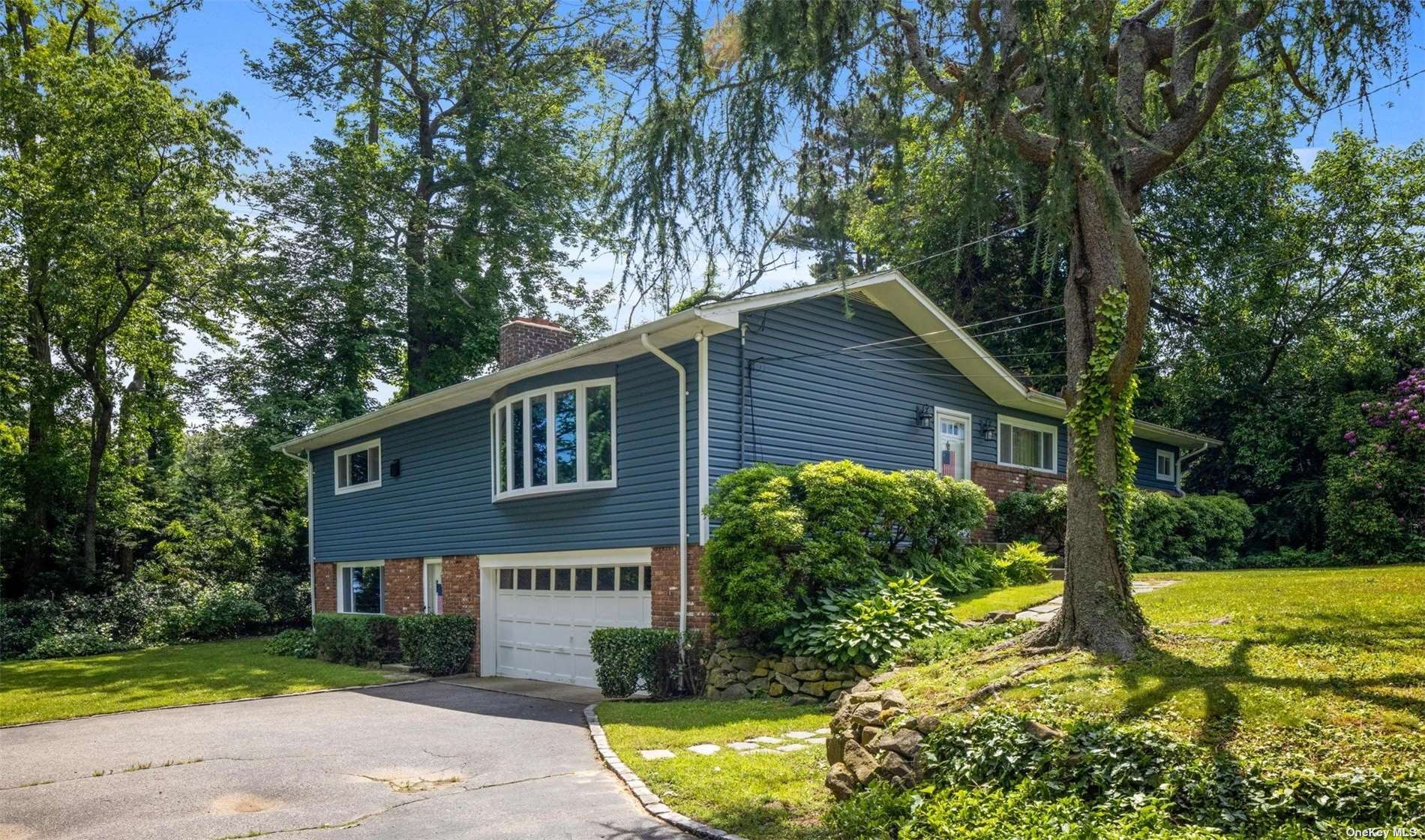 934 The Concourse Mill Neck, NY 11765 - Photo 1 of 1 a view of a yard in front of house
