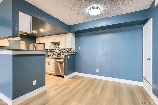 a view of a kitchen with a sink