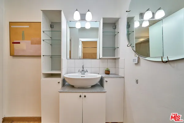 a bathroom with a sink and a mirror