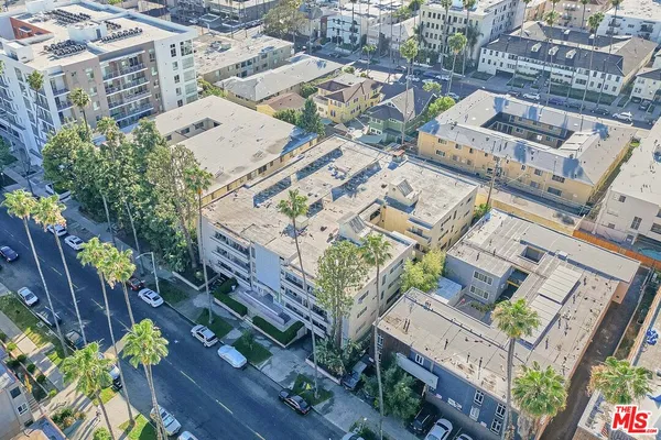 an aerial view of a house with outdoor space
