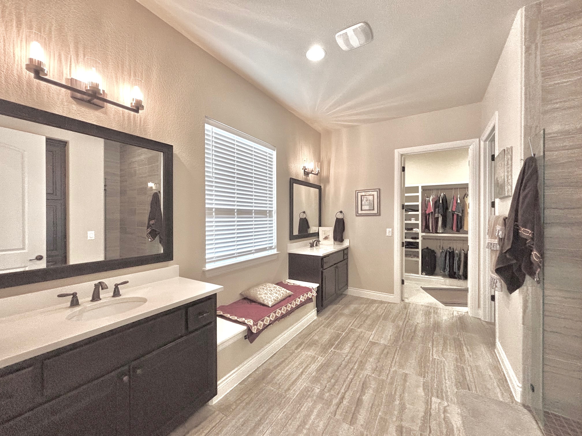 820 Desaix Drive Georgetown, TX 78628 - Photo 21 of 35 a spacious bathroom with a double vanity sink a mirror and a shower