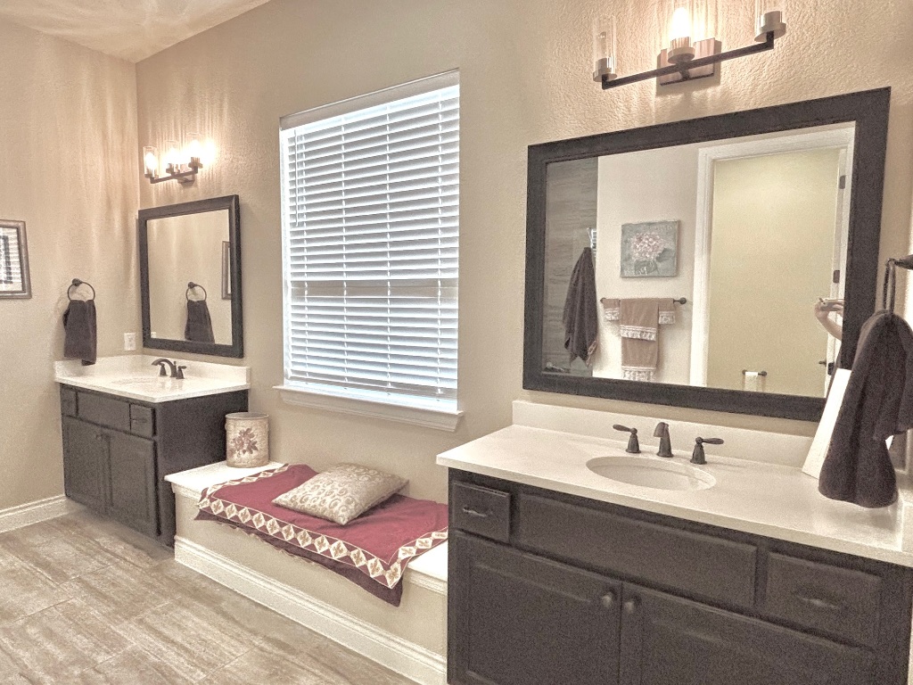 820 Desaix Drive Georgetown, TX 78628 - Photo 22 of 35 a bathroom with a granite countertop sink and a mirror
