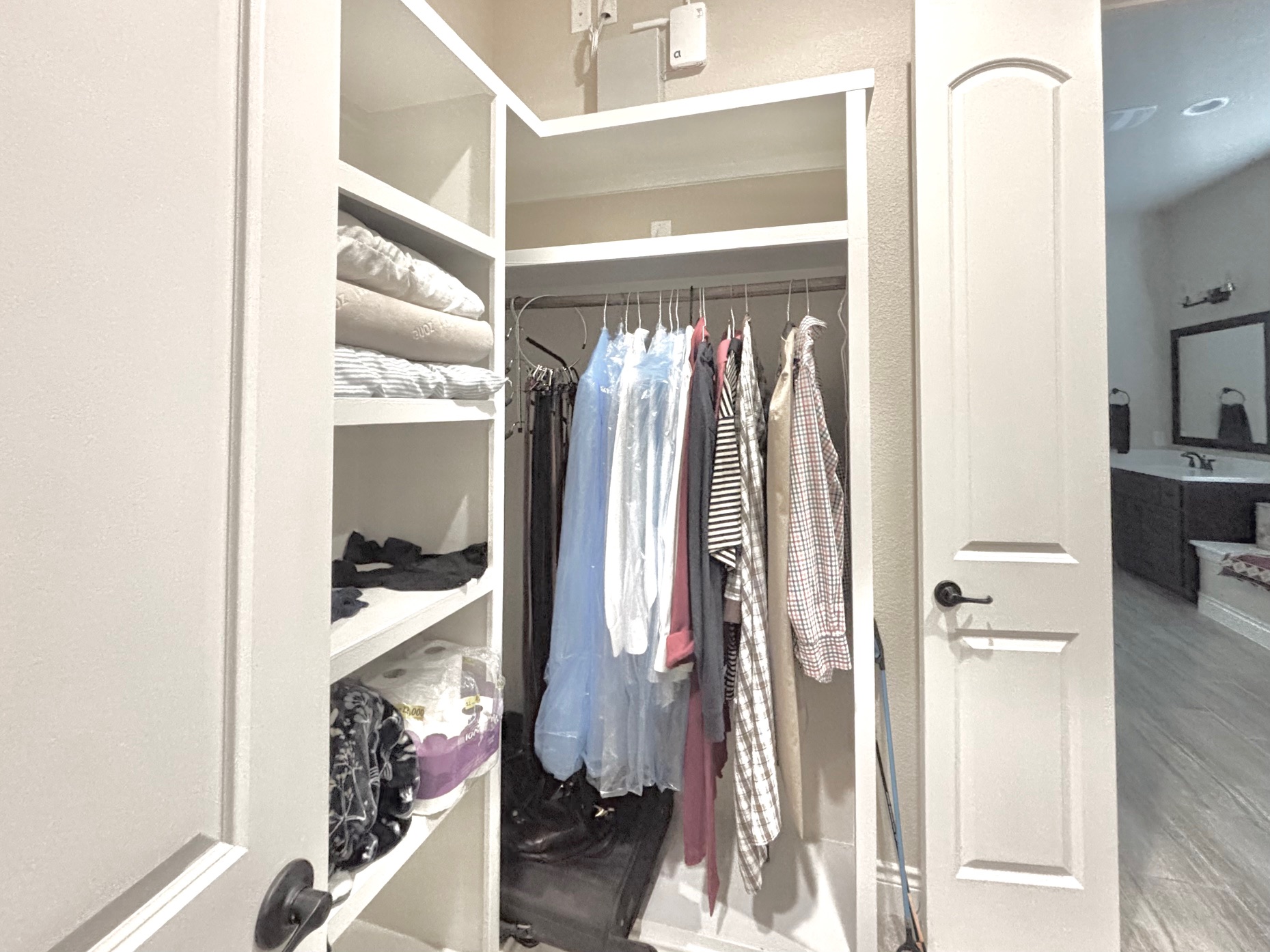 820 Desaix Drive Georgetown, TX 78628 - Photo 27 of 35 a view of walk in closet with clothes and shoes