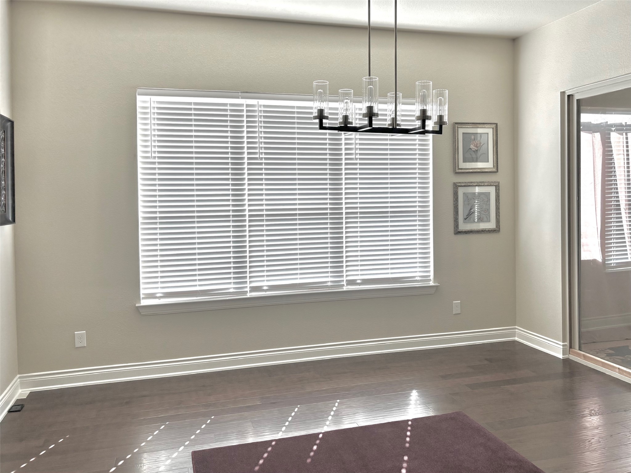 820 Desaix Drive Georgetown, TX 78628 - Photo 7 of 35 an empty room with wooden floor and windows