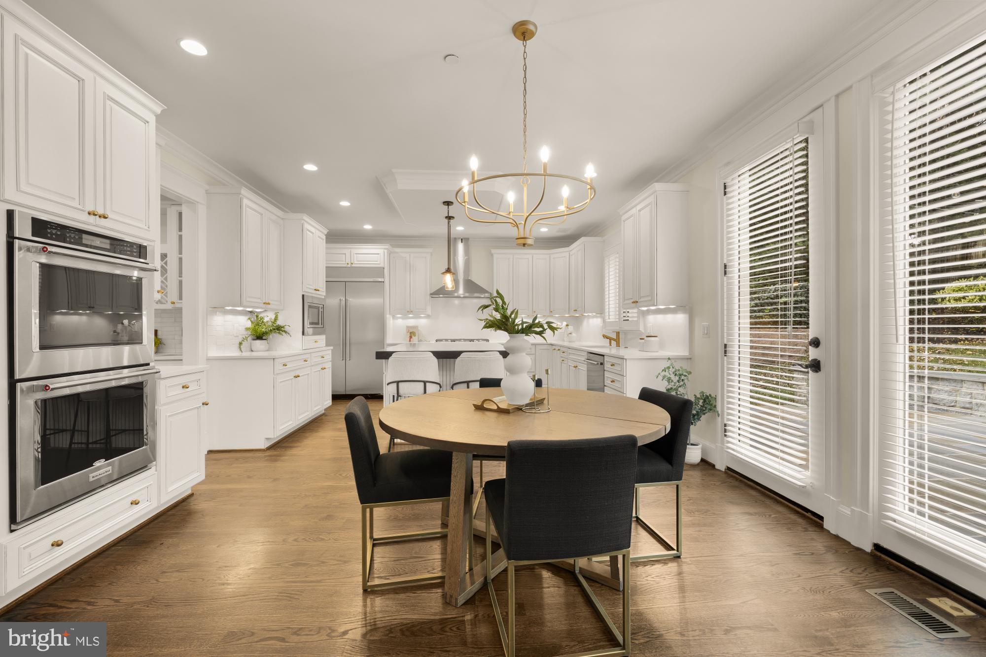 4609 Glenbrook Parkway Bethesda, MD 20814 - Photo 16 of 62 a large kitchen with a table and chairs