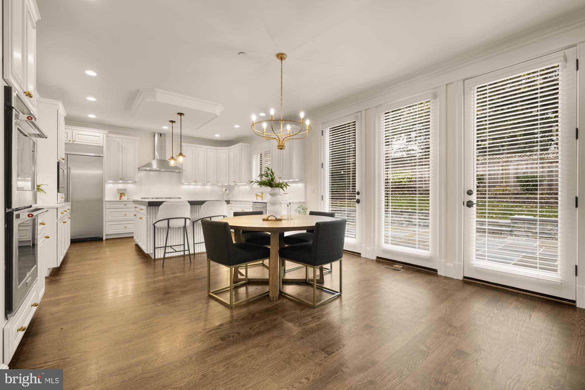 4609 Glenbrook Parkway Bethesda, MD 20814 - Photo 17 of 62 a kitchen with stainless steel appliances kitchen island granite countertop a sink and cabinets