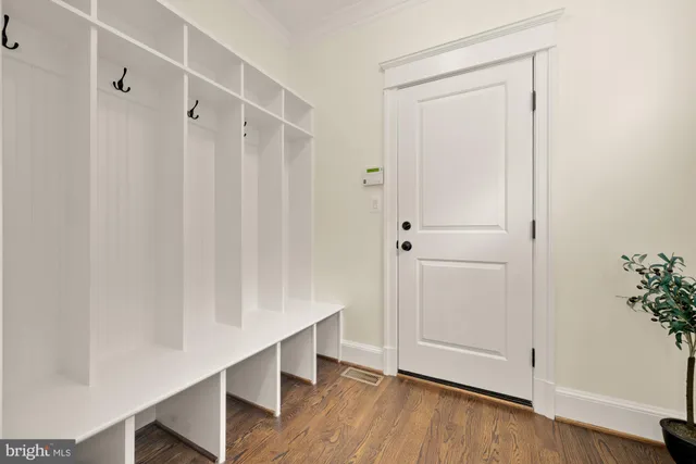 a spacious bedroom with a large bed and a large window