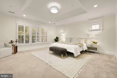 a bathroom with a double vanity sink and mirror