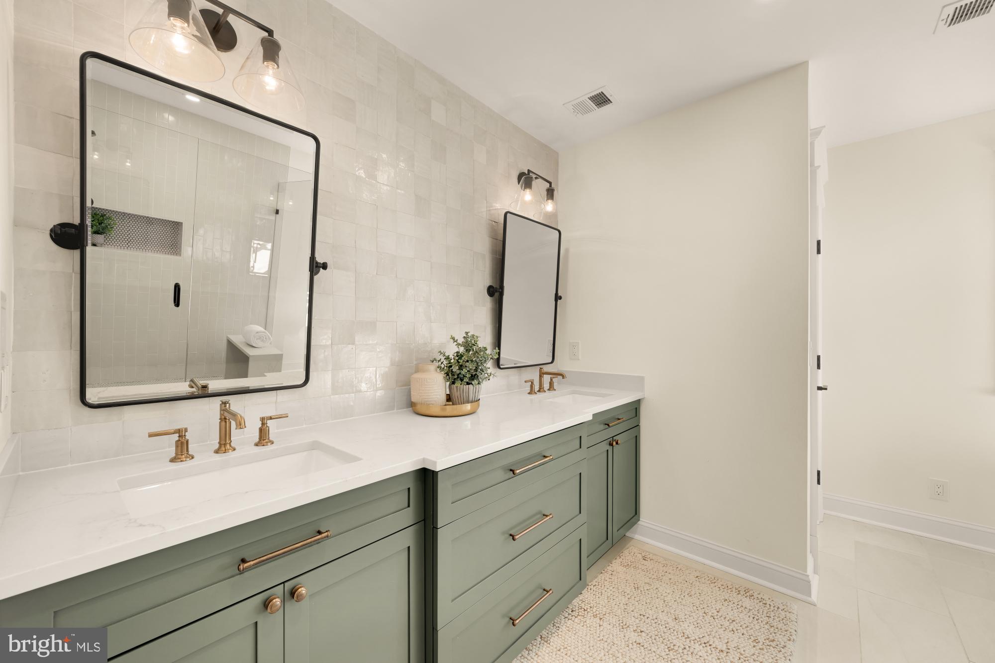 4609 Glenbrook Parkway Bethesda, MD 20814 - Photo 29 of 62 a bathroom with a double vanity sink mirror and double