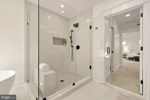 an empty room with wooden floor and window