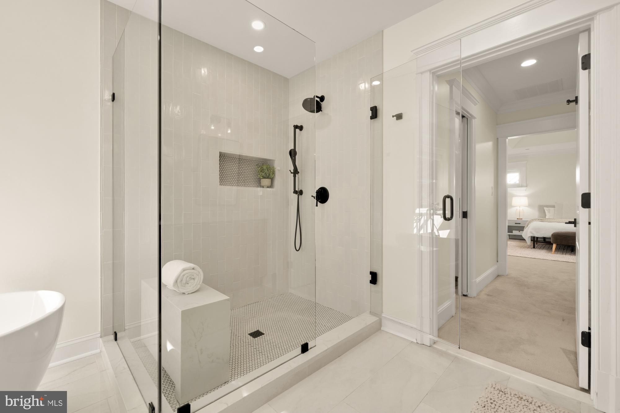 4609 Glenbrook Parkway Bethesda, MD 20814 - Photo 30 of 62 a bathroom with a glass shower door