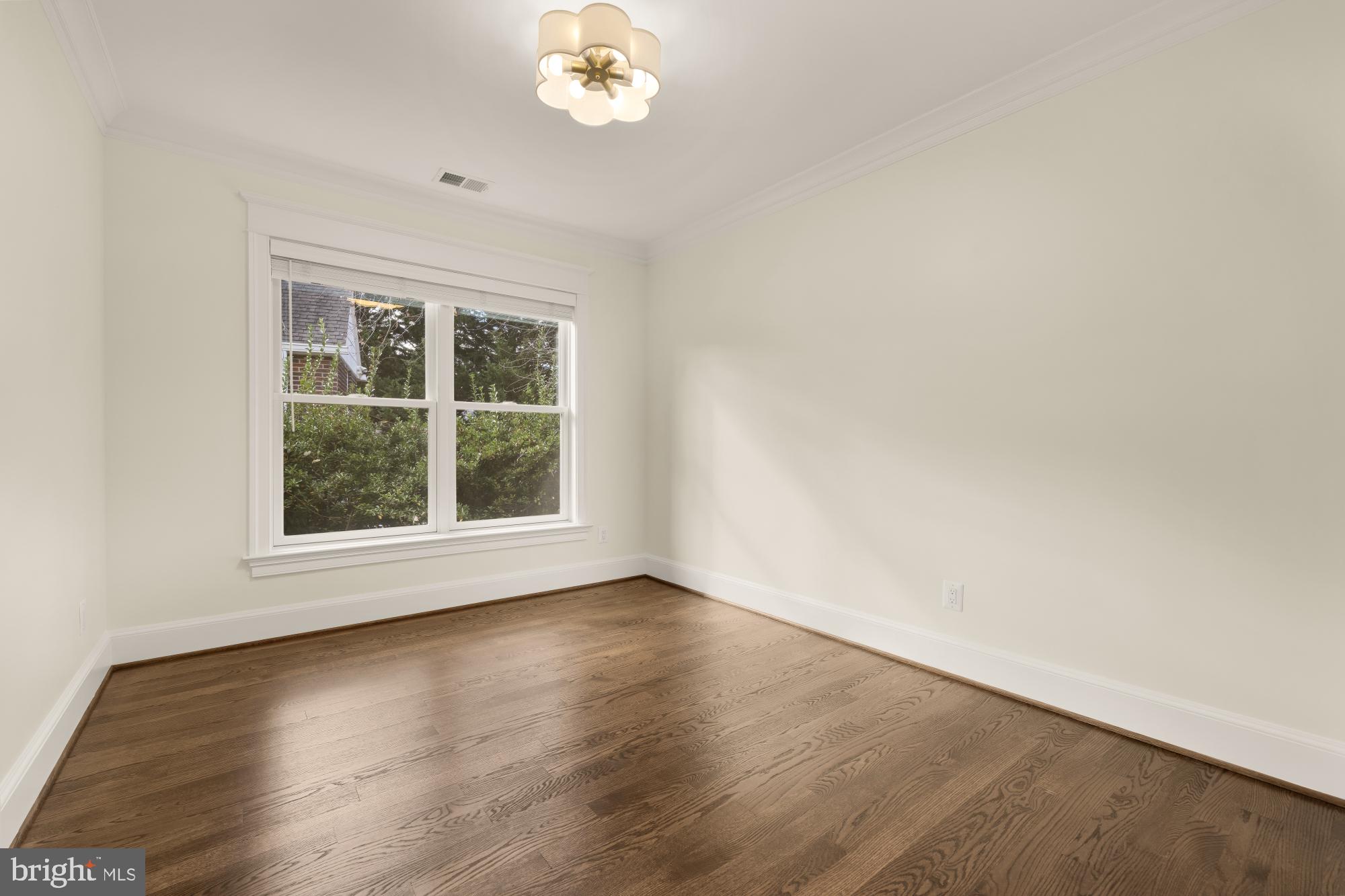 4609 Glenbrook Parkway Bethesda, MD 20814 - Photo 34 of 62 an empty room with wooden floor and window