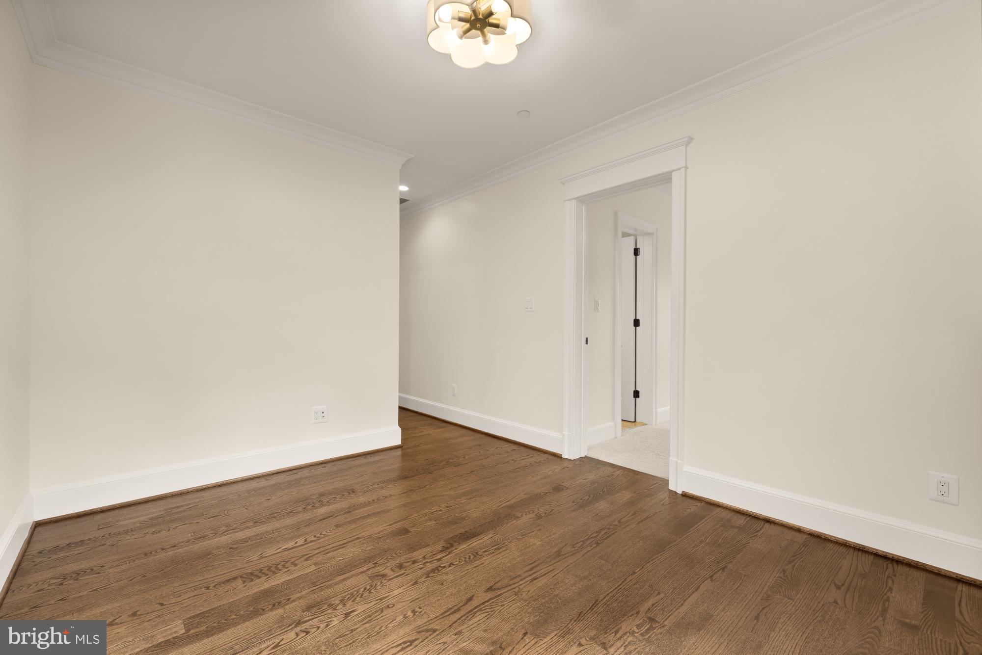 4609 Glenbrook Parkway Bethesda, MD 20814 - Photo 35 of 62 an empty room with wooden floor and window