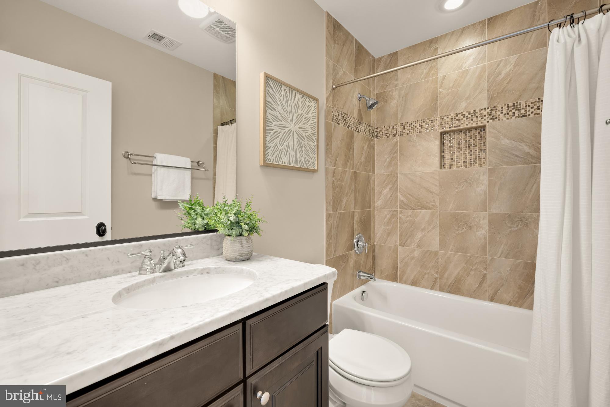 4609 Glenbrook Parkway Bethesda, MD 20814 - Photo 44 of 62 a bathroom with a granite countertop sink toilet and shower