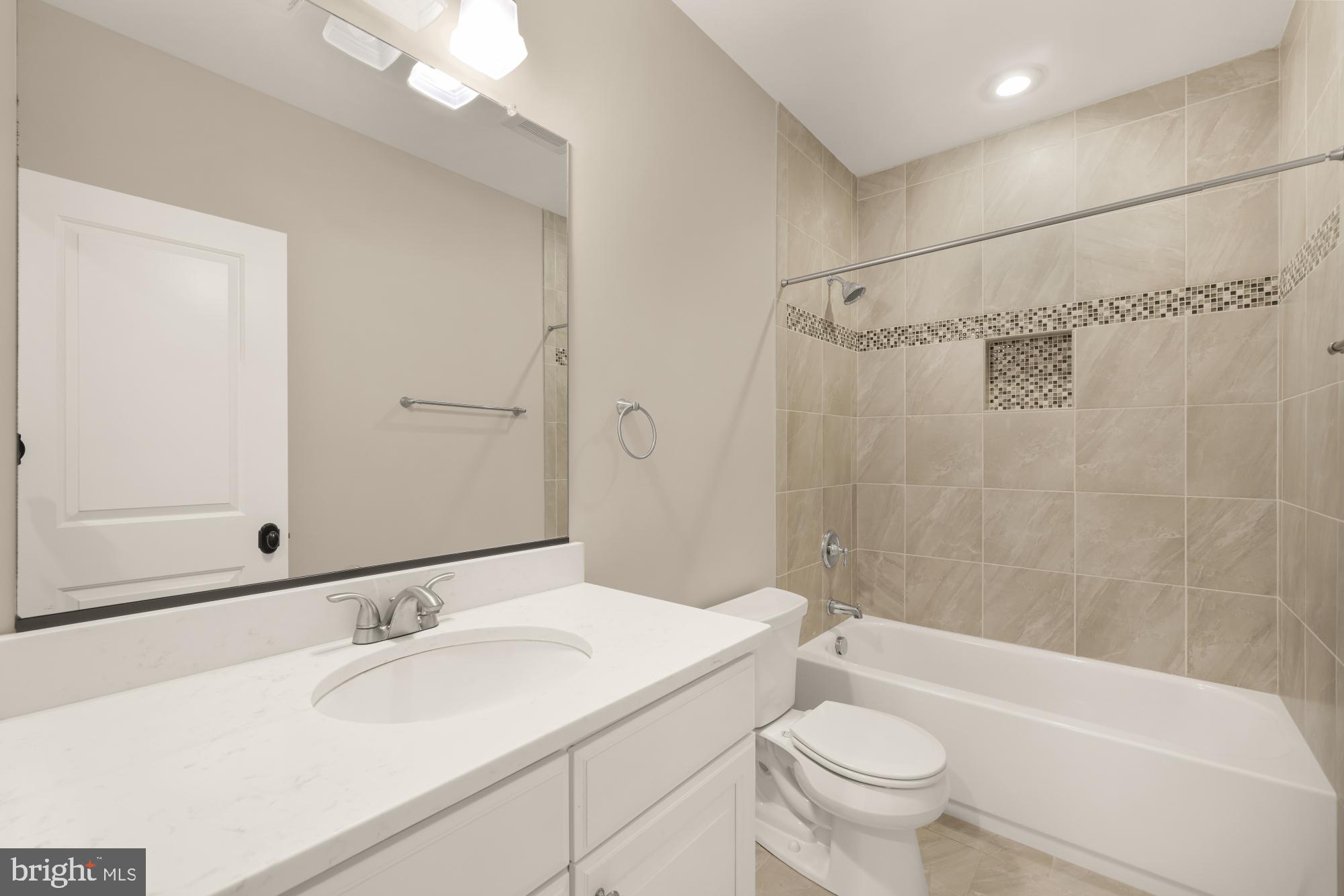 4609 Glenbrook Parkway Bethesda, MD 20814 - Photo 56 of 62 a bathroom with a sink a toilet and shower