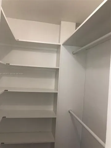 a view of an empty walk in closet