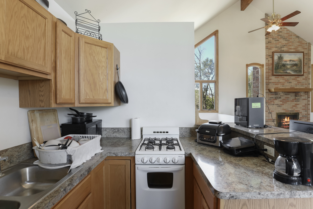 2-n584 Ardmore Avenue Addison, IL 60101 - Photo 23 of 33 a kitchen with stainless steel appliances granite countertop a sink stove and cabinets