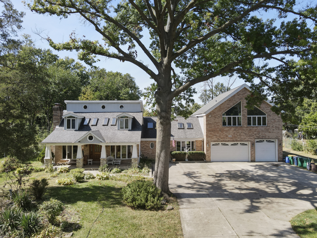 2-n584 Ardmore Avenue Addison, IL 60101 - Photo 33 of 33 a front view of a house with a garden and trees
