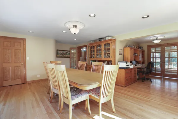 a view of a dining room with furniture and wooden floor