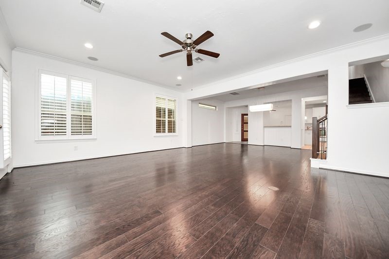 4222 Drake Street Houston, TX 77005 - Photo 8 of 28 a view of a livingroom with a ceiling fan and wooden floor