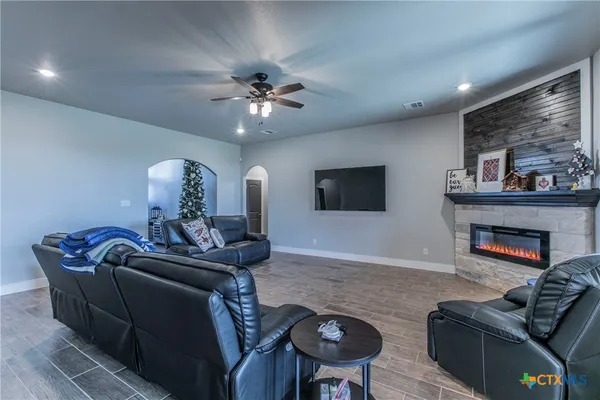 a living room with furniture and a fireplace