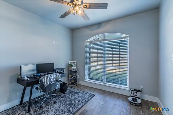 a workspace with furniture and a window