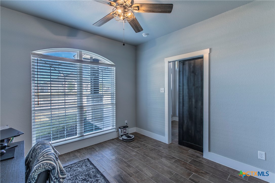 8323 Torrente Drive Temple, TX 76504 - Photo 26 of 30 wooden floor in an empty room with a window